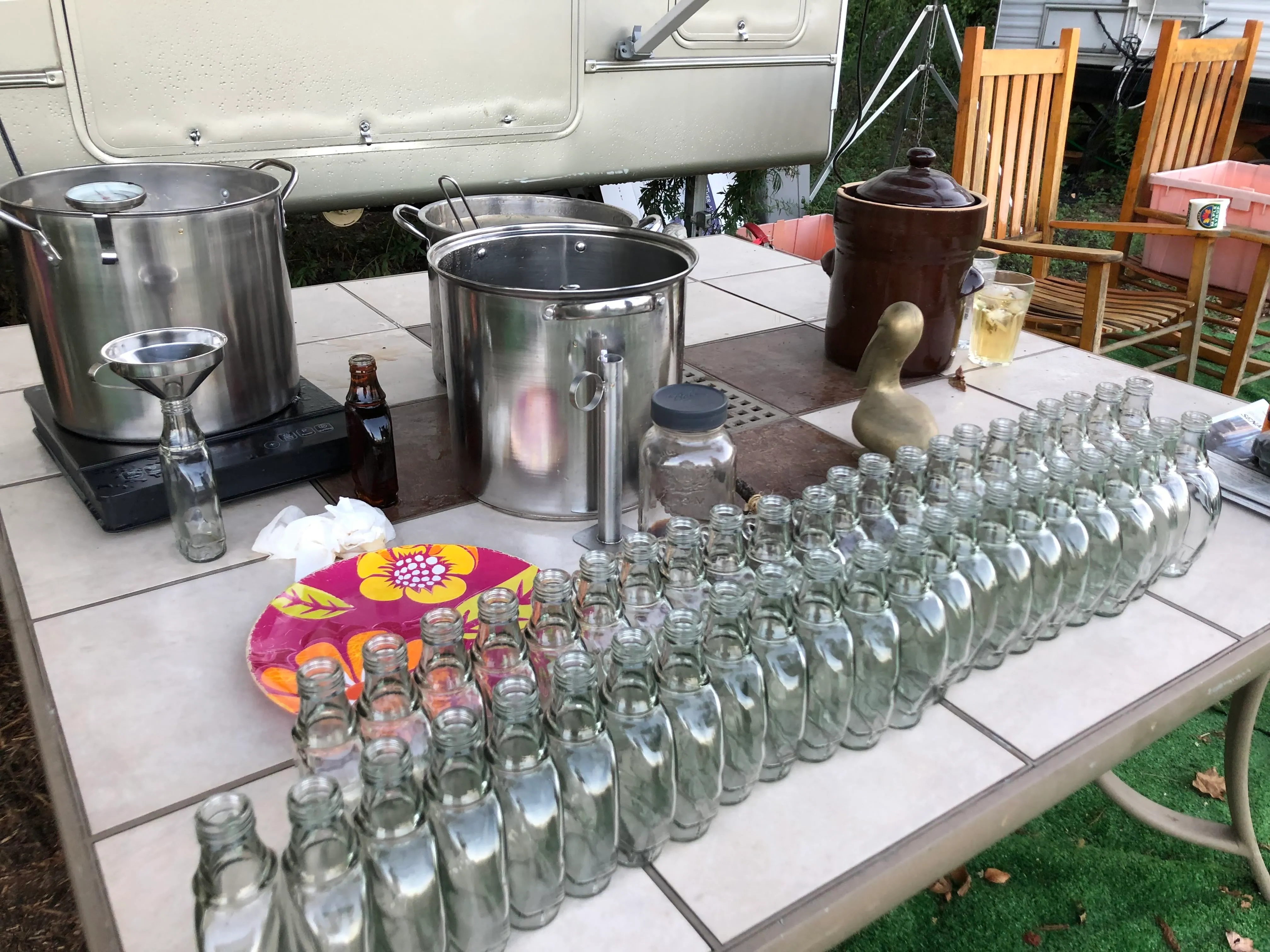 Glass bottles lined up and ready for filling with fresh maple syrup