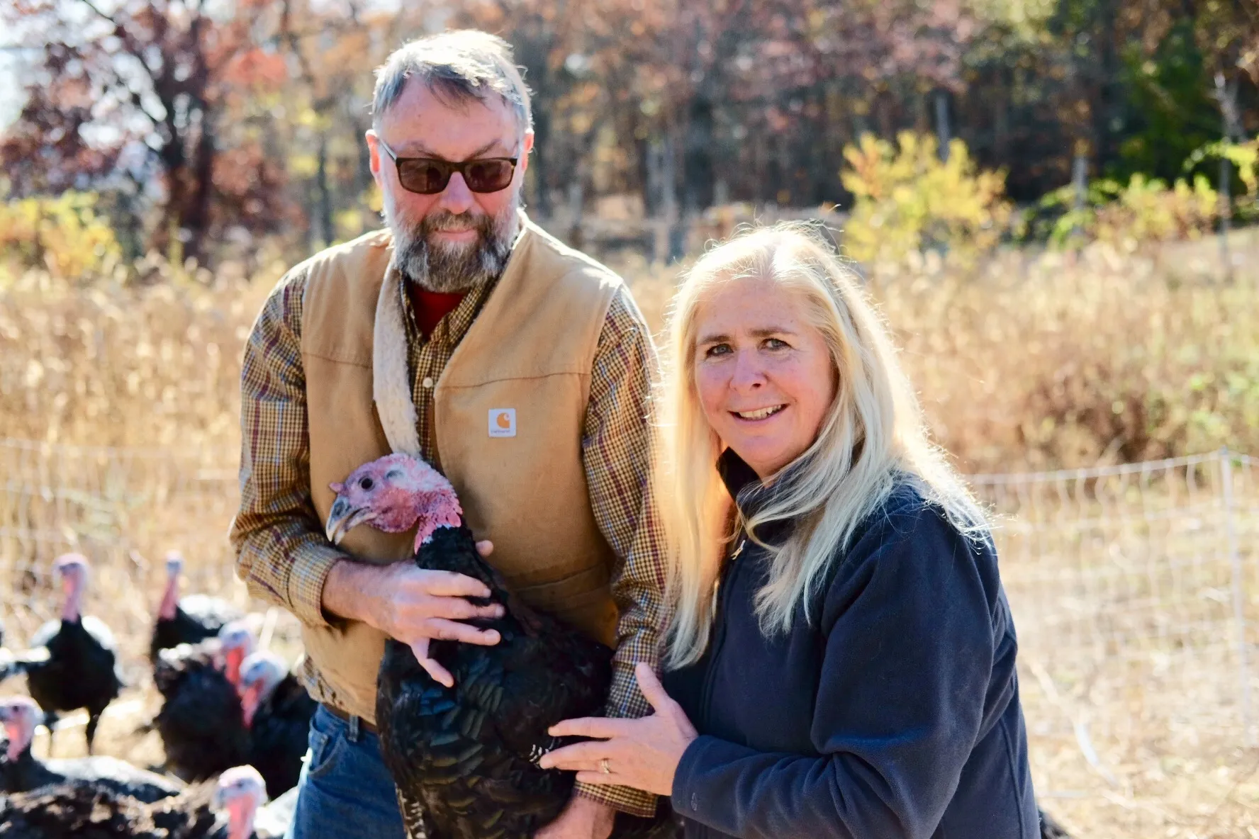 Roger and Shelley Gray with one of their turkeys on the farm